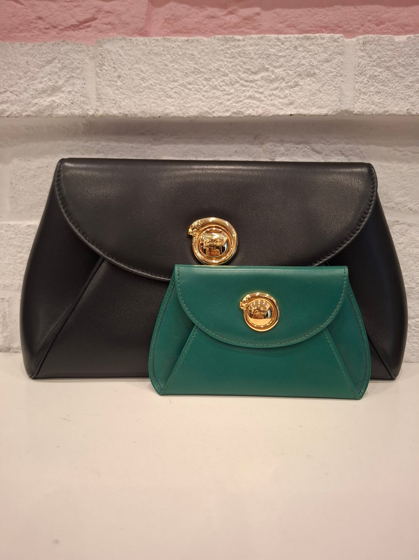 Pochette Cartier nera + portafogli