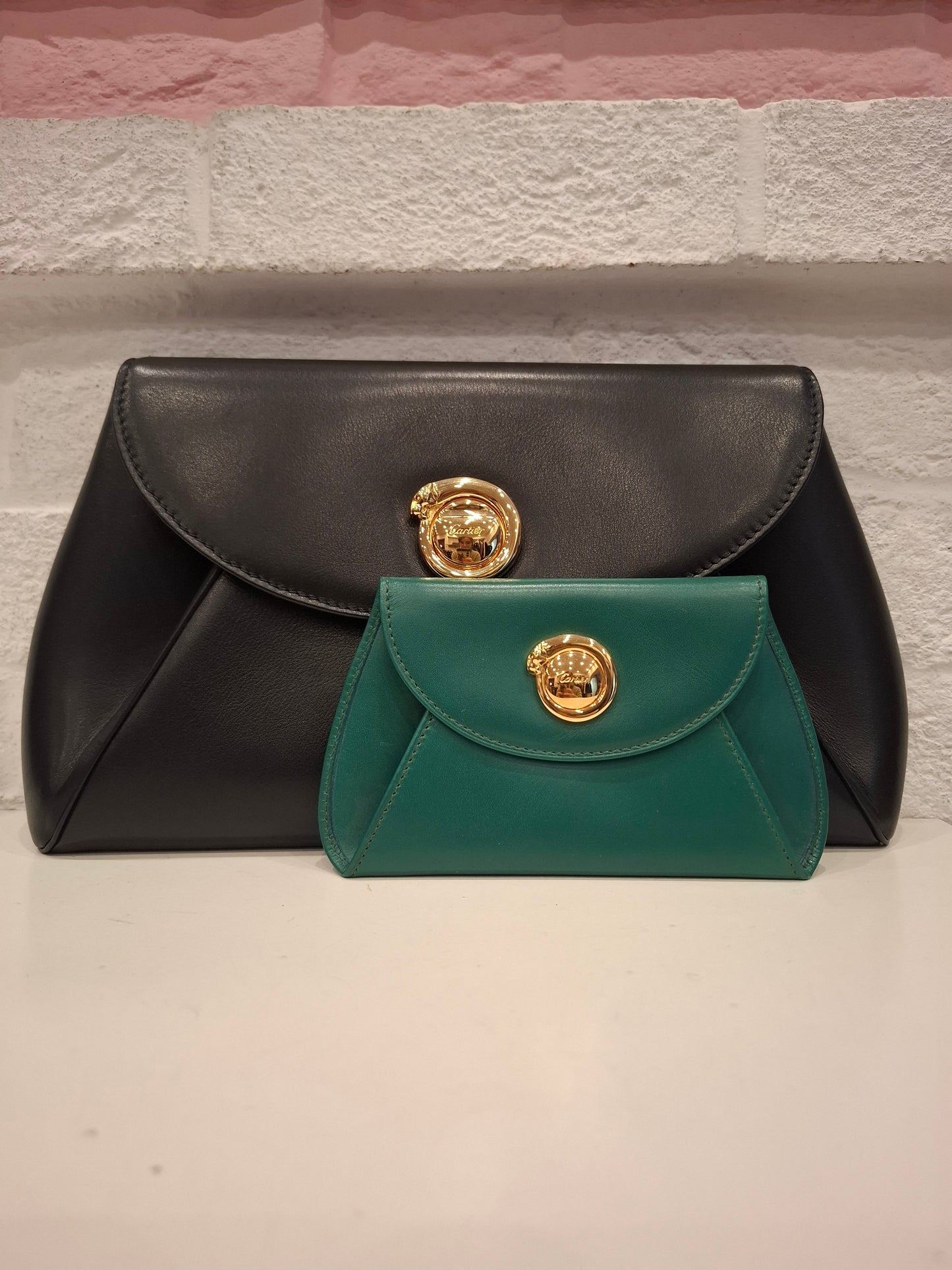 Pochette Cartier nera + portafogli