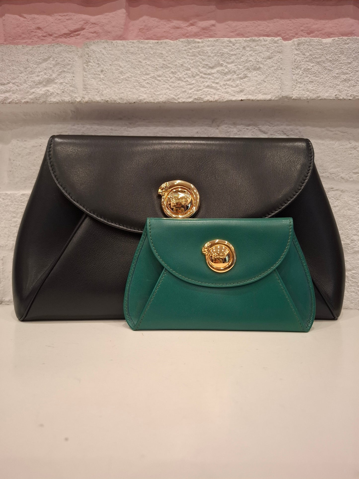 Pochette Cartier nera + portafogli