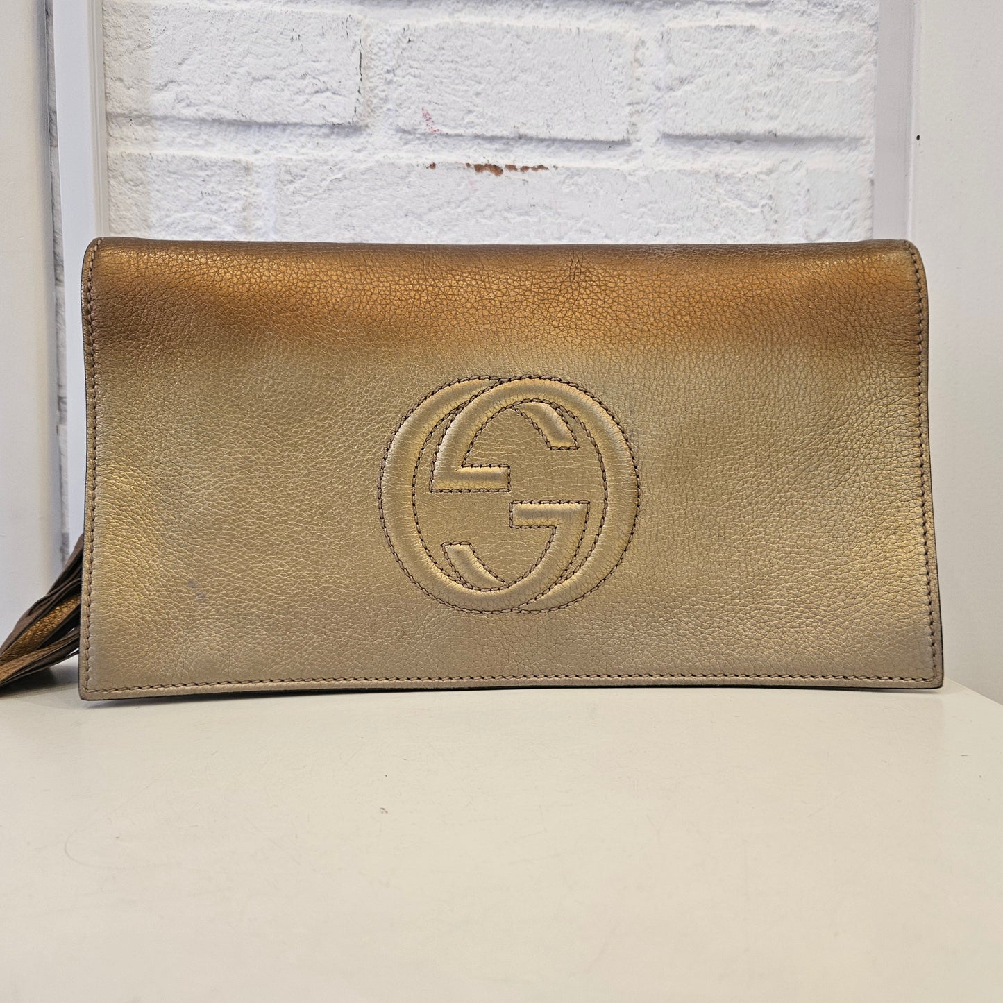 Clutch Gucci Soho metallic Gold