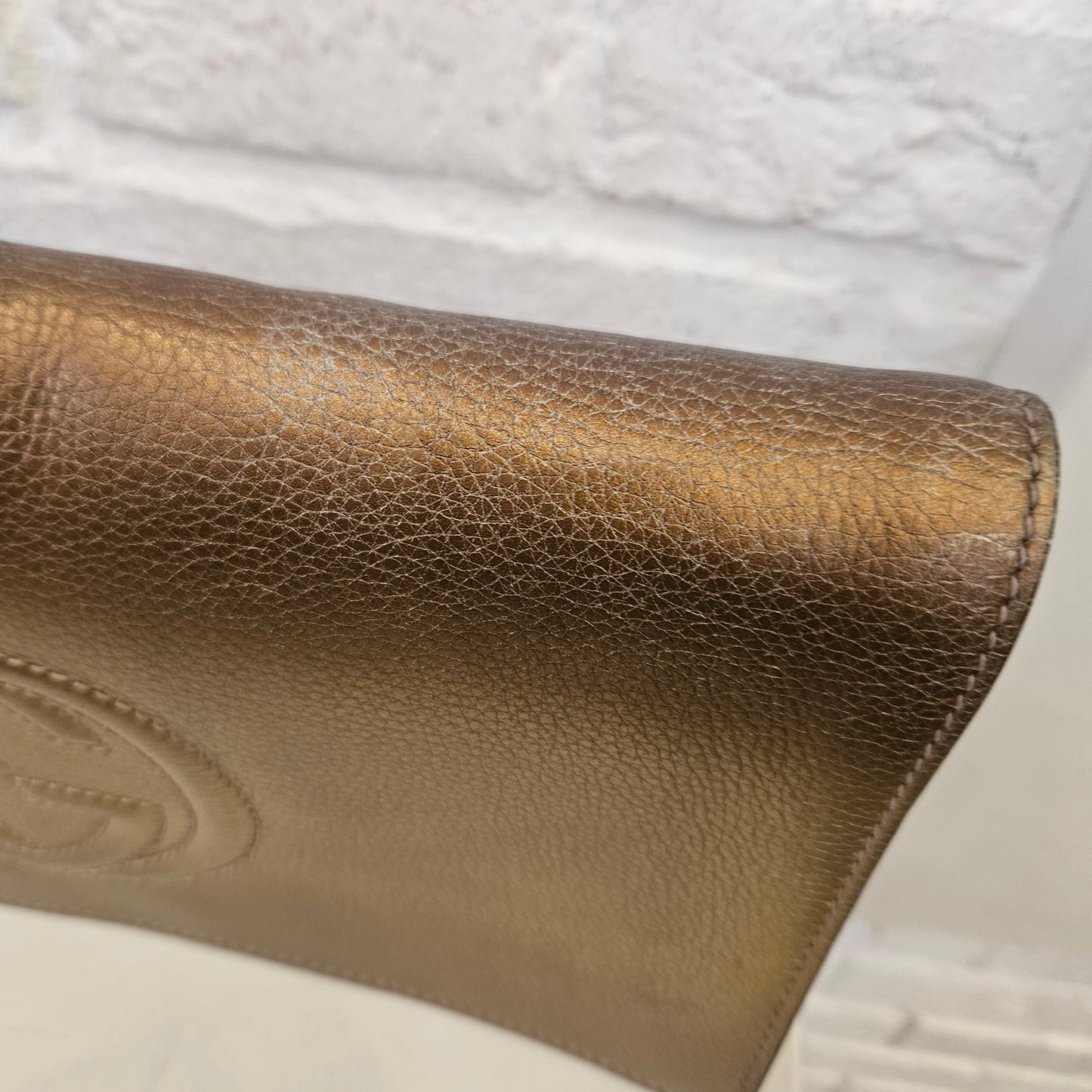 Clutch Gucci Soho metallic Gold