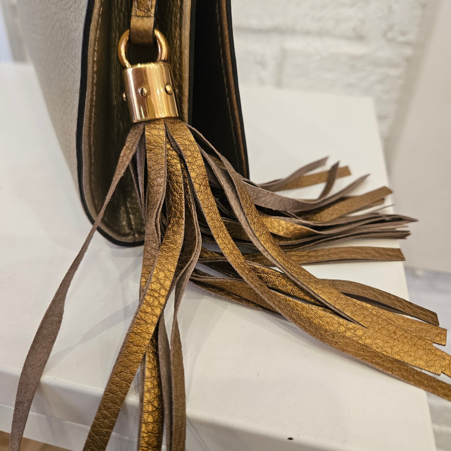 Clutch Gucci Soho metallic Gold