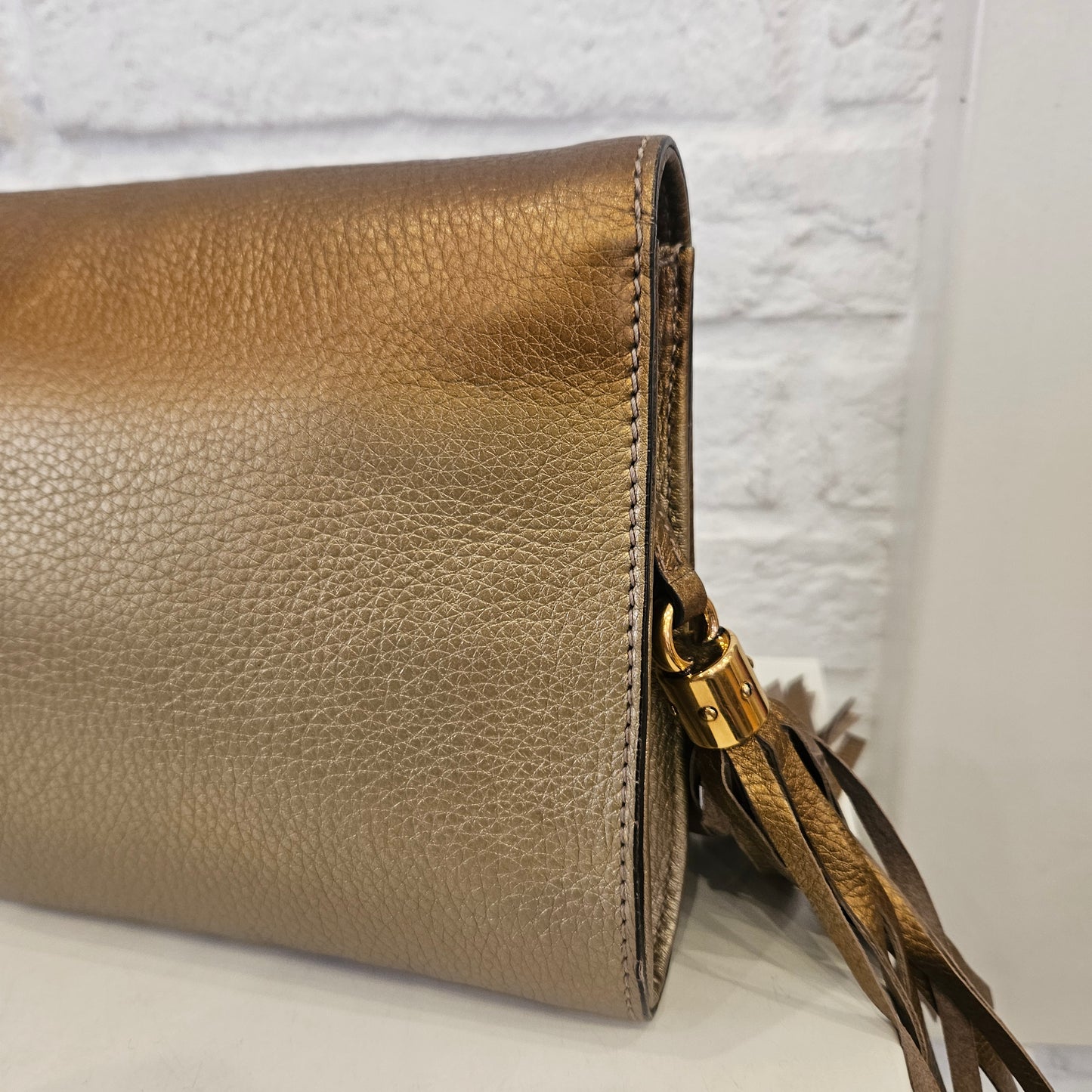 Clutch Gucci Soho metallic Gold